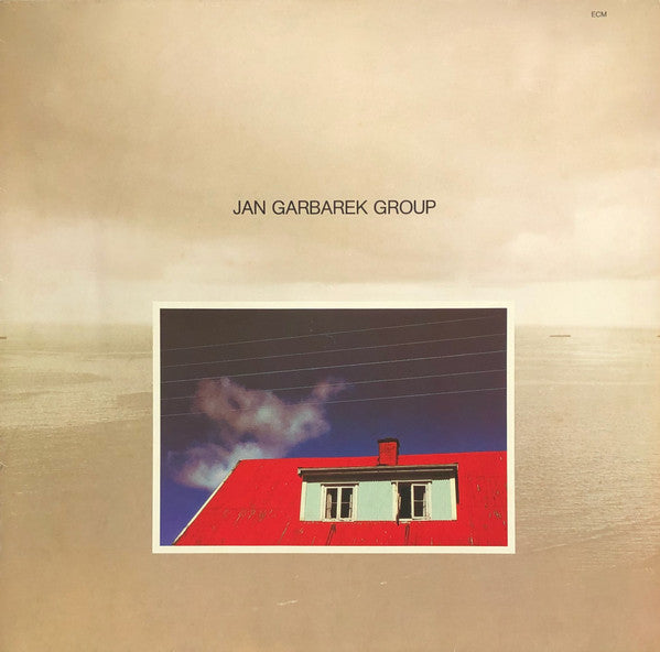 Jan Garbarek Group - Photo With Blue Sky, White Cloud, Wires, Windows And A Red Roof
